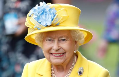 Queen Elizabeth II watches her horse 'Fabricate' run in the Wolferton Stakes