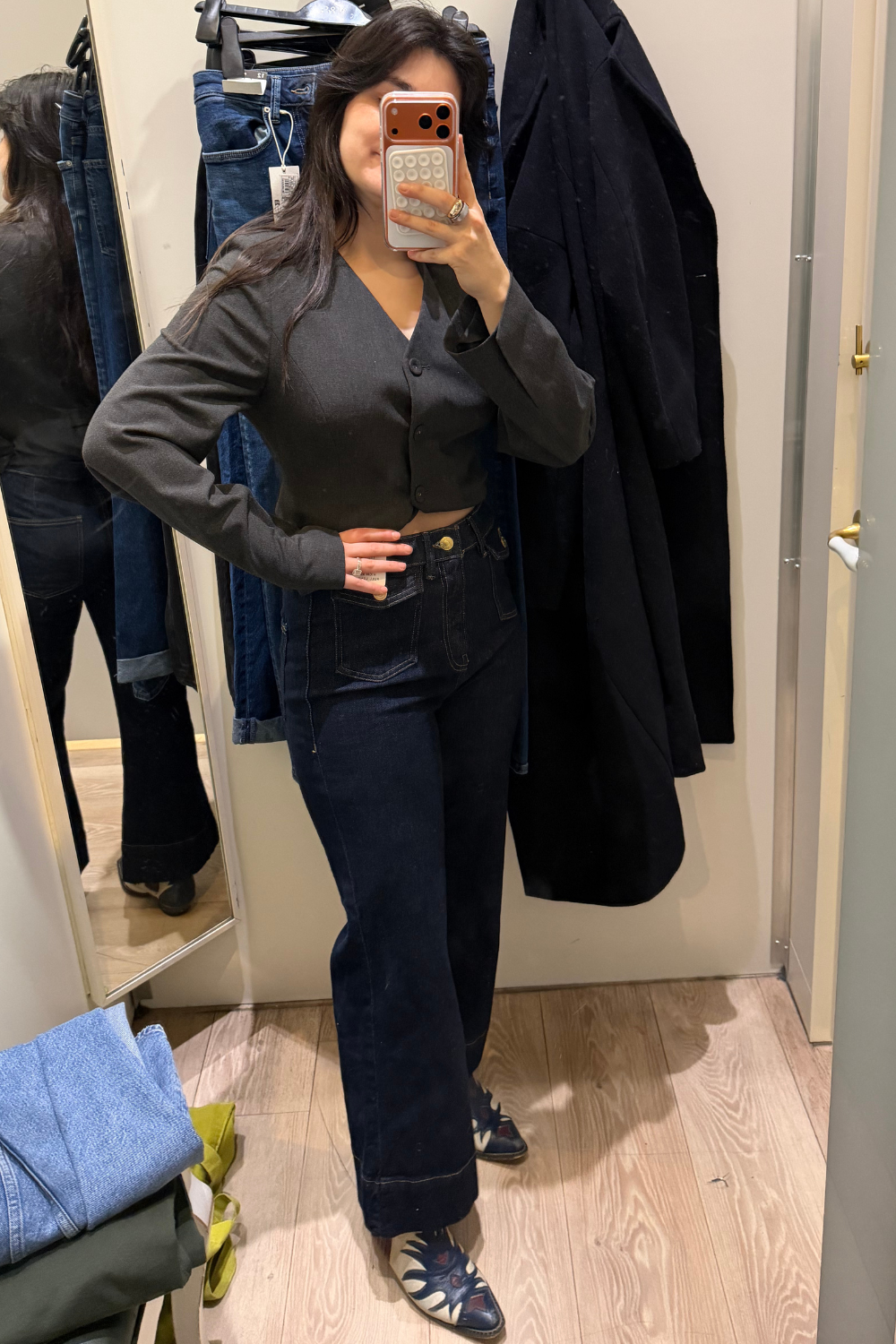 Sofia wearing flared jeans