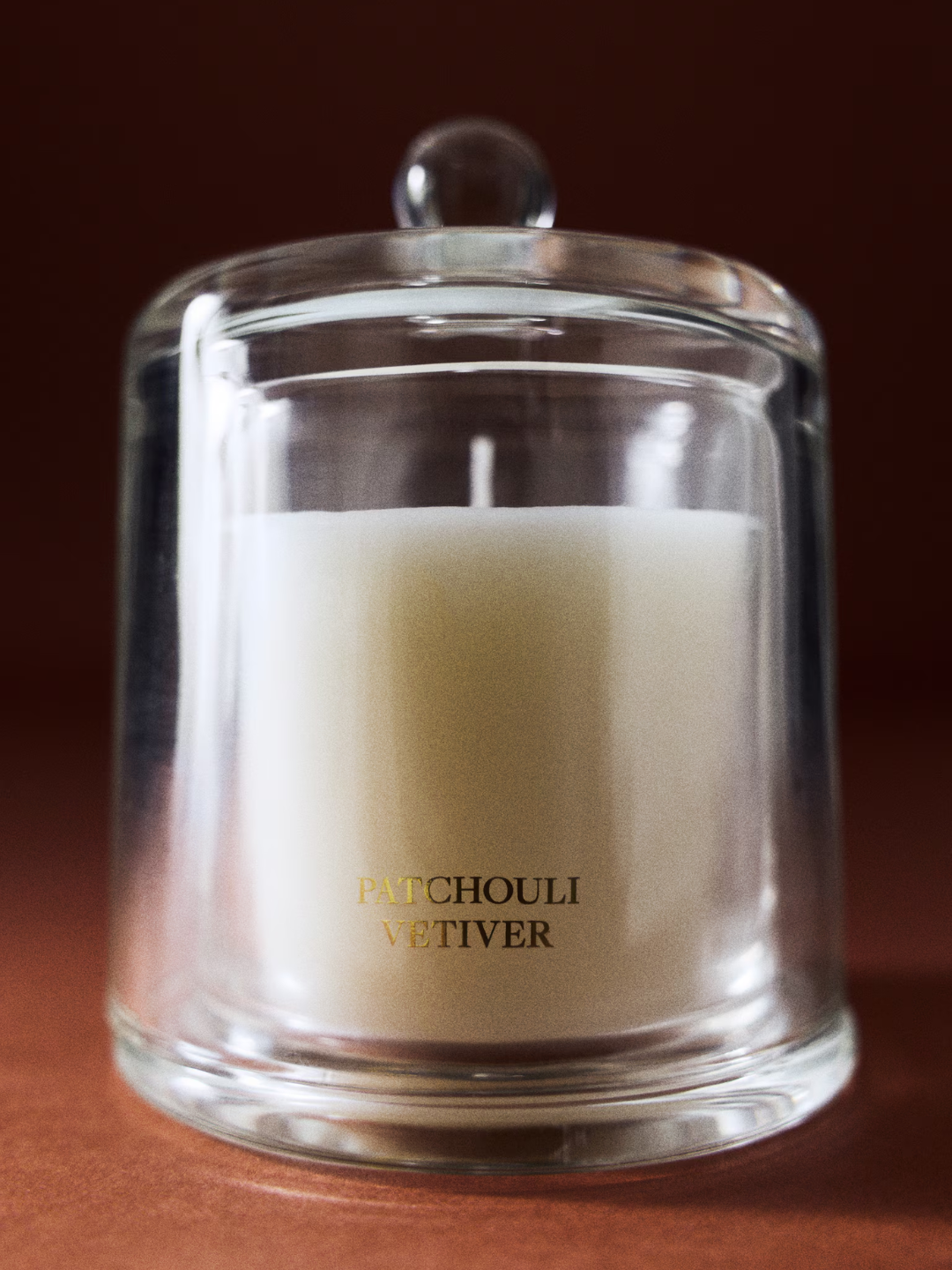 A clear glass cloche-lid scented candle from H&amp;amp;M