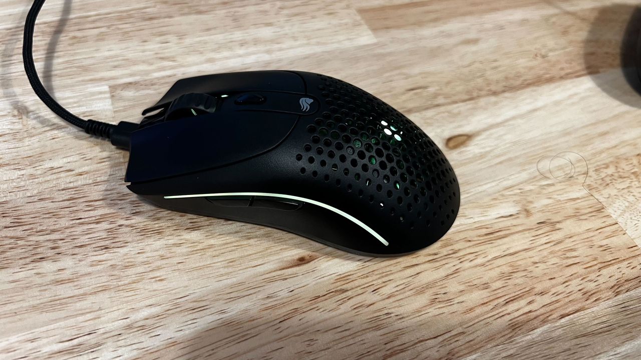 Glorious Model O2 wireless mouse on a desk.