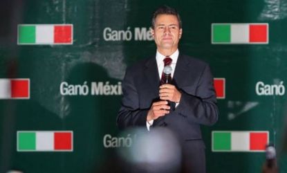 Enrique Pena Nieto addresses supporters on July 1 in Mexico City, Mexico: Pena Nieto gave a victory speech to supporters after early results announced by the Federal Electoral Institute gave 