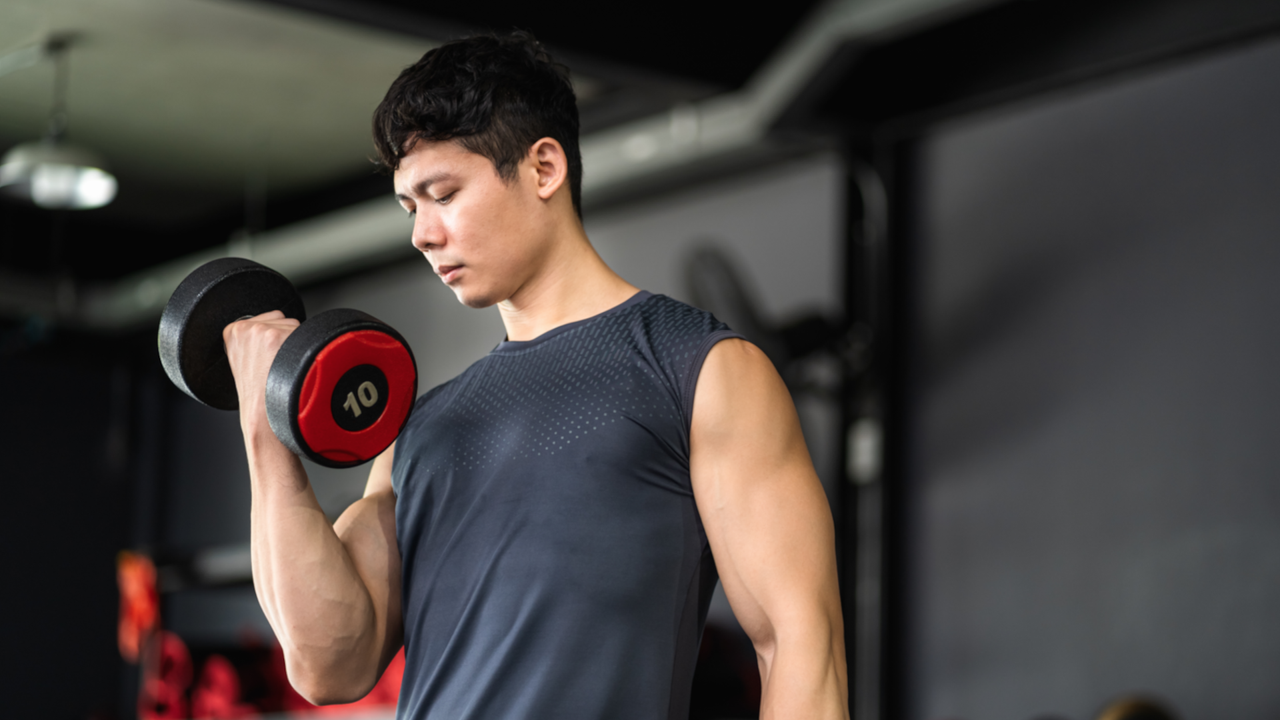 Man lifting dumbbells