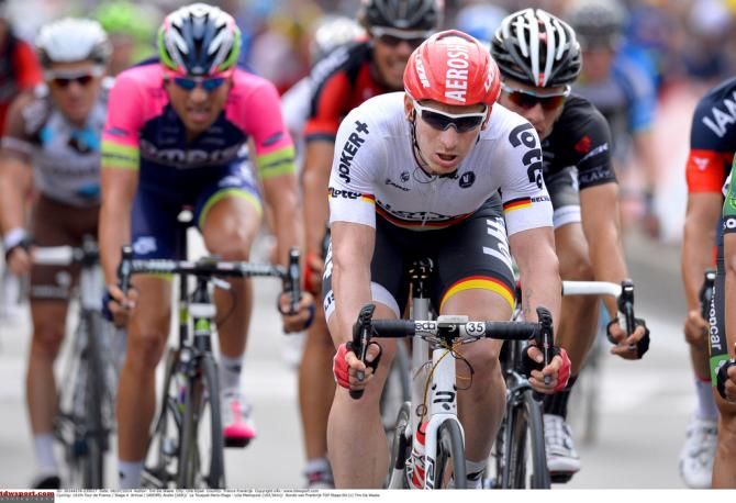 Andr&eacute; Greipel (Lotto-Belisol) crosses the line