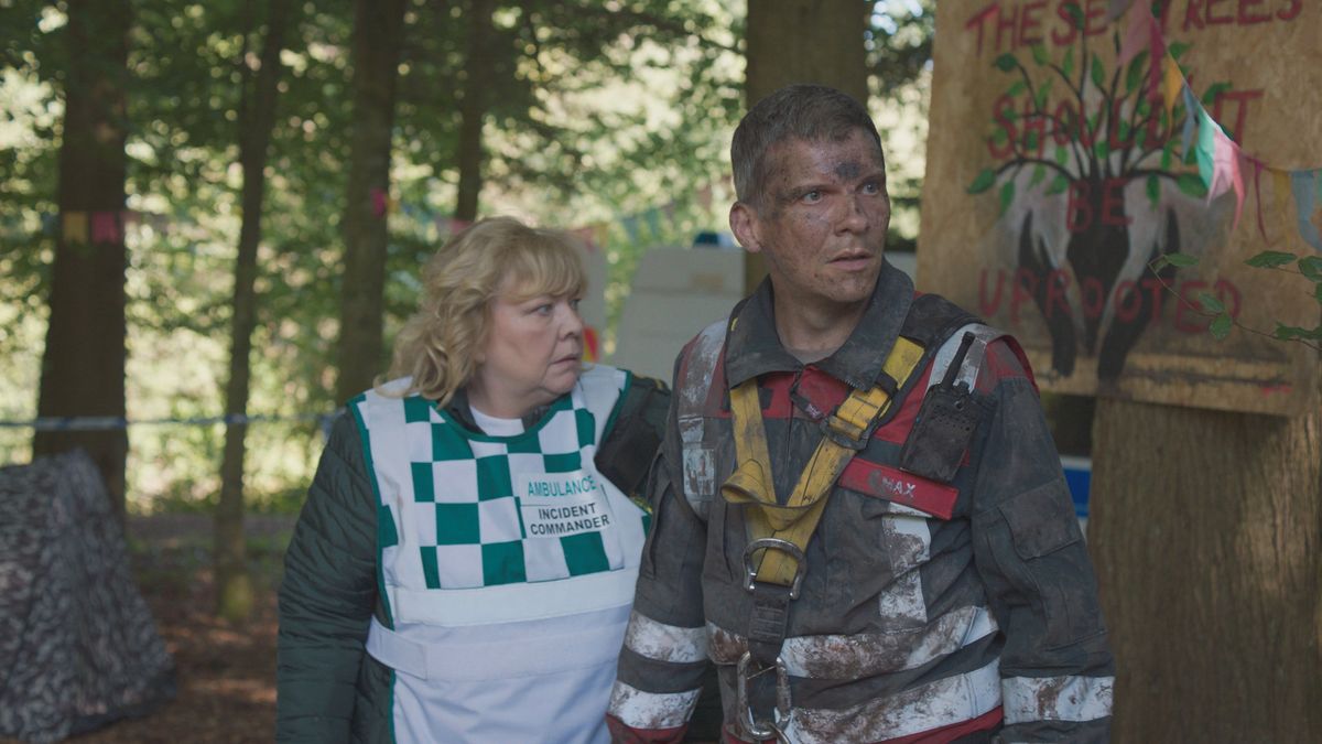 Max Cristie pictured looking rough beside paramedic Jan Janning.