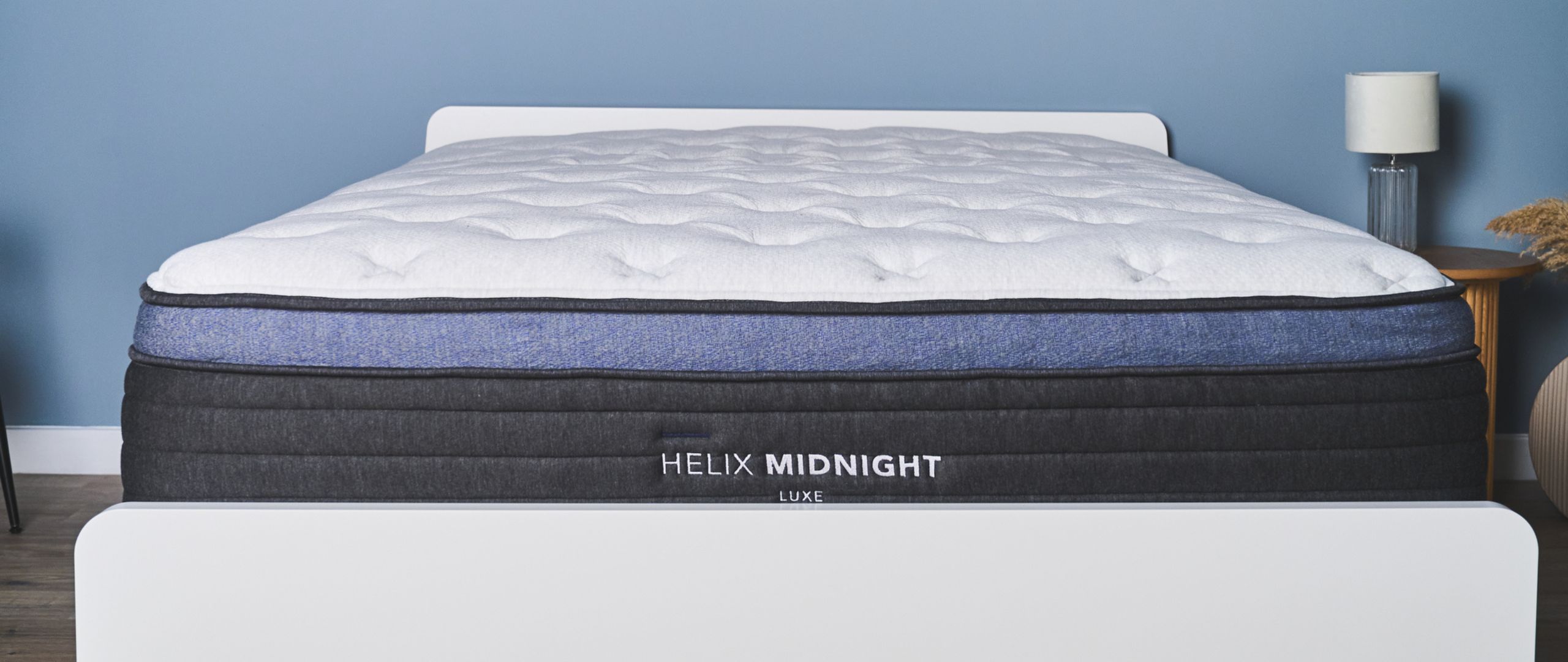 The Helix Midnight Luxe mattress on a bed frame in the Tom's Guide Sleep Studio