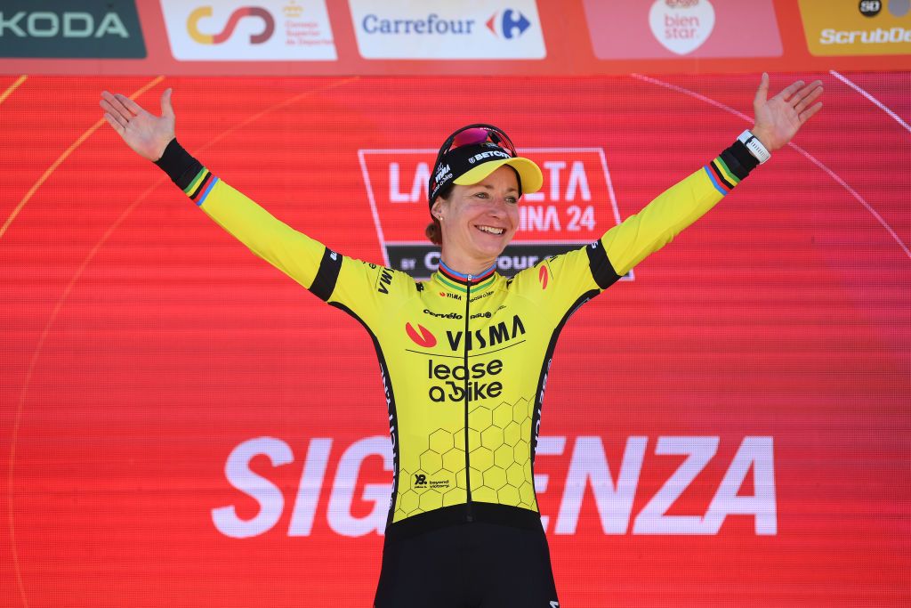 SIGUENZA SPAIN MAY 04 Marianne Vos of The Netherlands and Team Visma Lease a Bike celebrates at podium as stage winner during the 10th La Vuelta Femenina 2024 Stage 7 a 1386km stage from San Esteban de Gormaz to Siguenza 1030m UCIWT on May 04 2024 in Siguenza Spain Photo by Alex BroadwayGetty Images