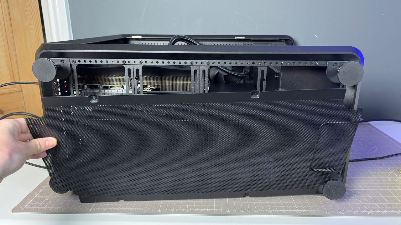 The CoolerMaster MasterFrame 360 Panoramic PC case with various components installed on a desk.