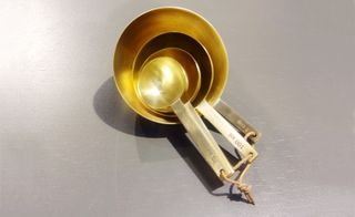A set of brass measurement spoons by Ferm Living