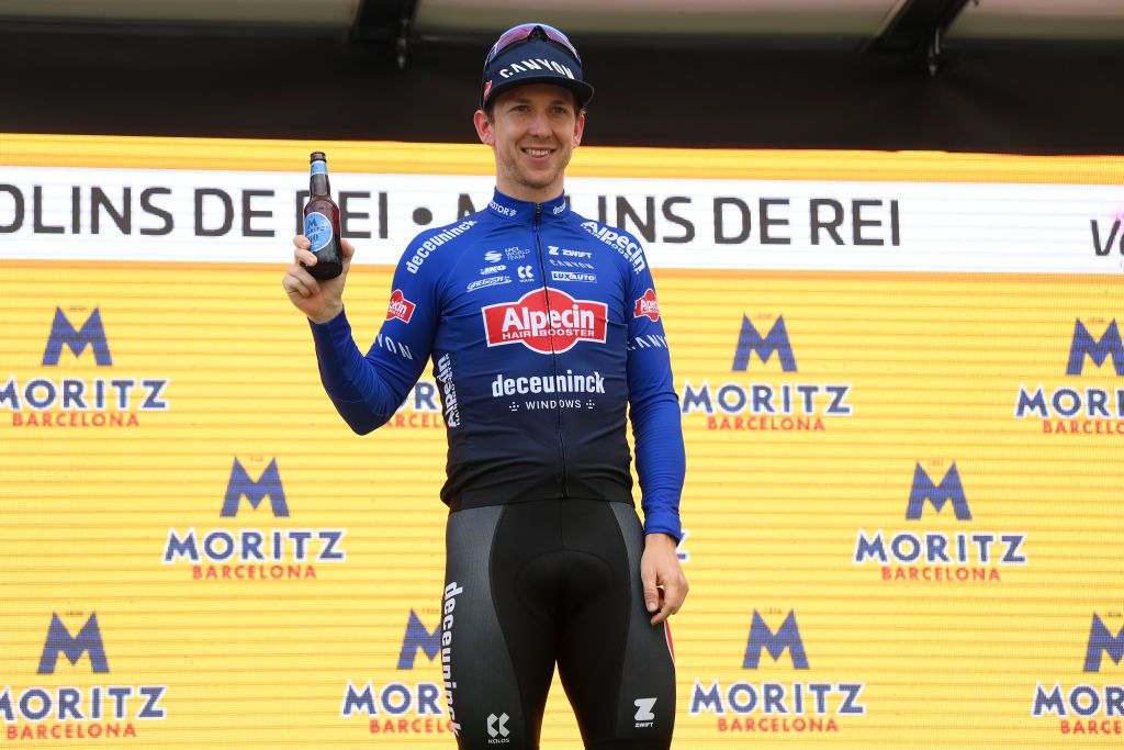 MOLINS DE REI SPAIN MARCH 25 Kaden Groves of Australia and Team AlpecinDeceuninck celebrates at podium as stage winner during the 102nd Volta Ciclista a Catalunya 2023 Stage 6 a 1741km stage from Martorell to Molins de Rei UCIWT on March 25 2023 in Molins de Rey Spain Photo by David RamosGetty Images