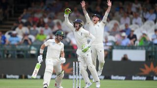 England wicketkeeper Jos Buttler takes the catch for the wicket of South Africa batsman Dean Elgar as Ben Stokes appeals