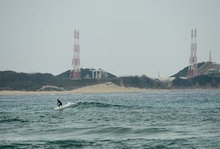 Surfer Catches Wave Near Tanegashima Space Center