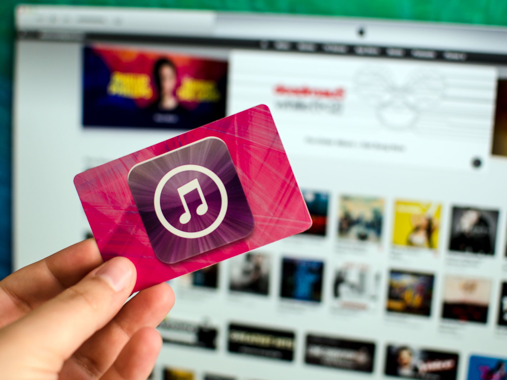 View on Apple Itunes and App Store Gift Voucher Card Hold by Hand