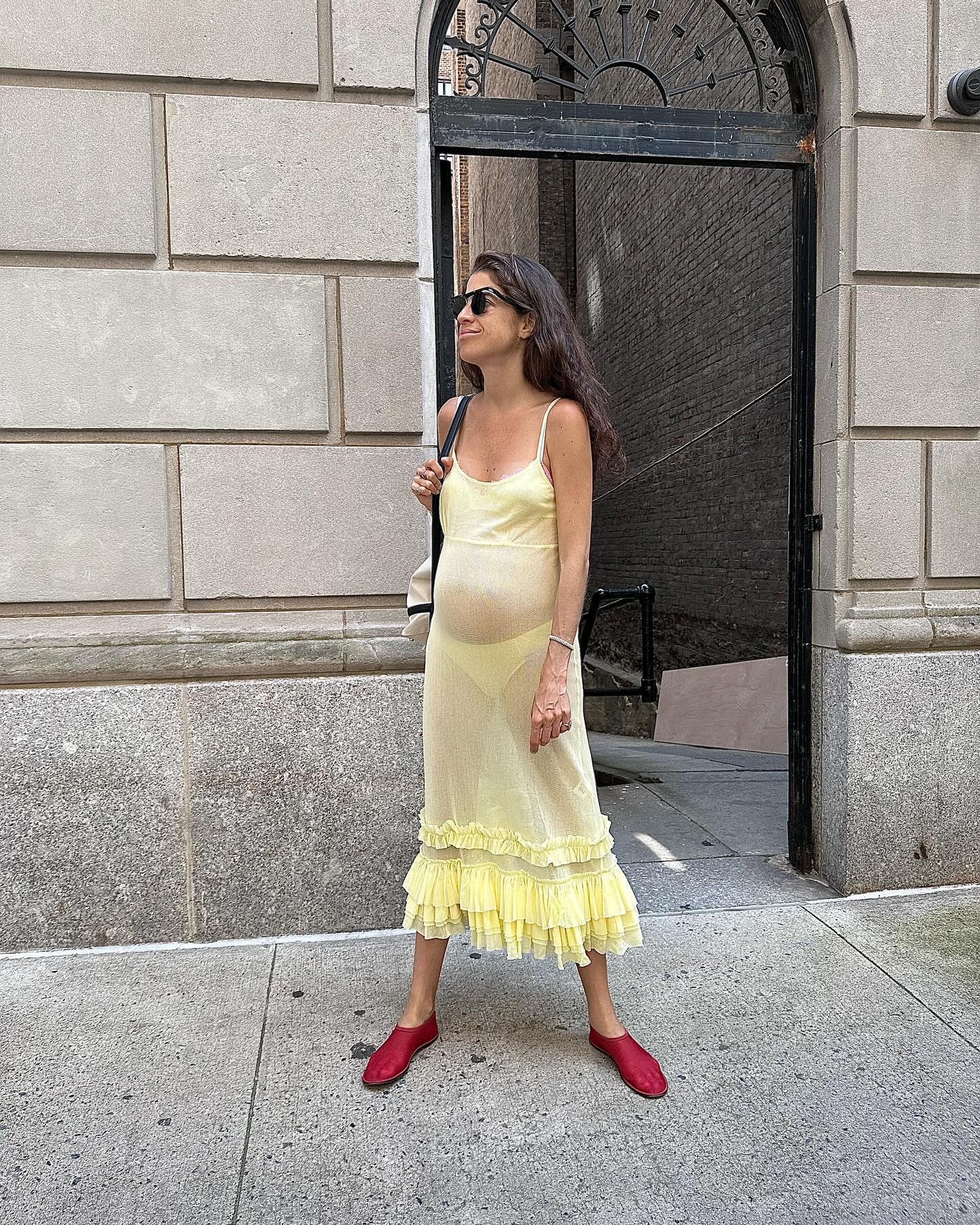 @leandramcohen wearing yellow dress and red flats