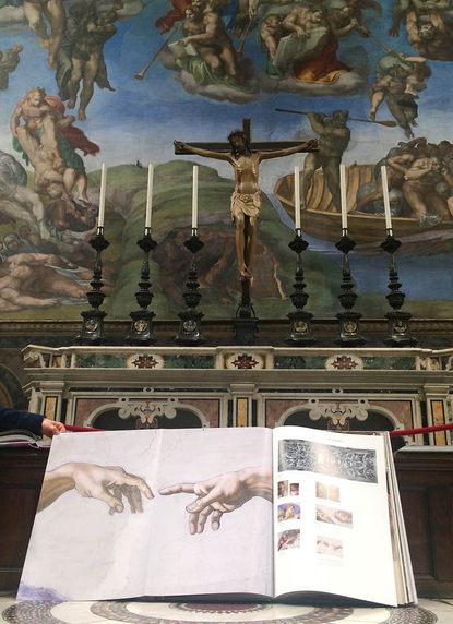 These books are filled with life-size photos of the Sistine Chapel.