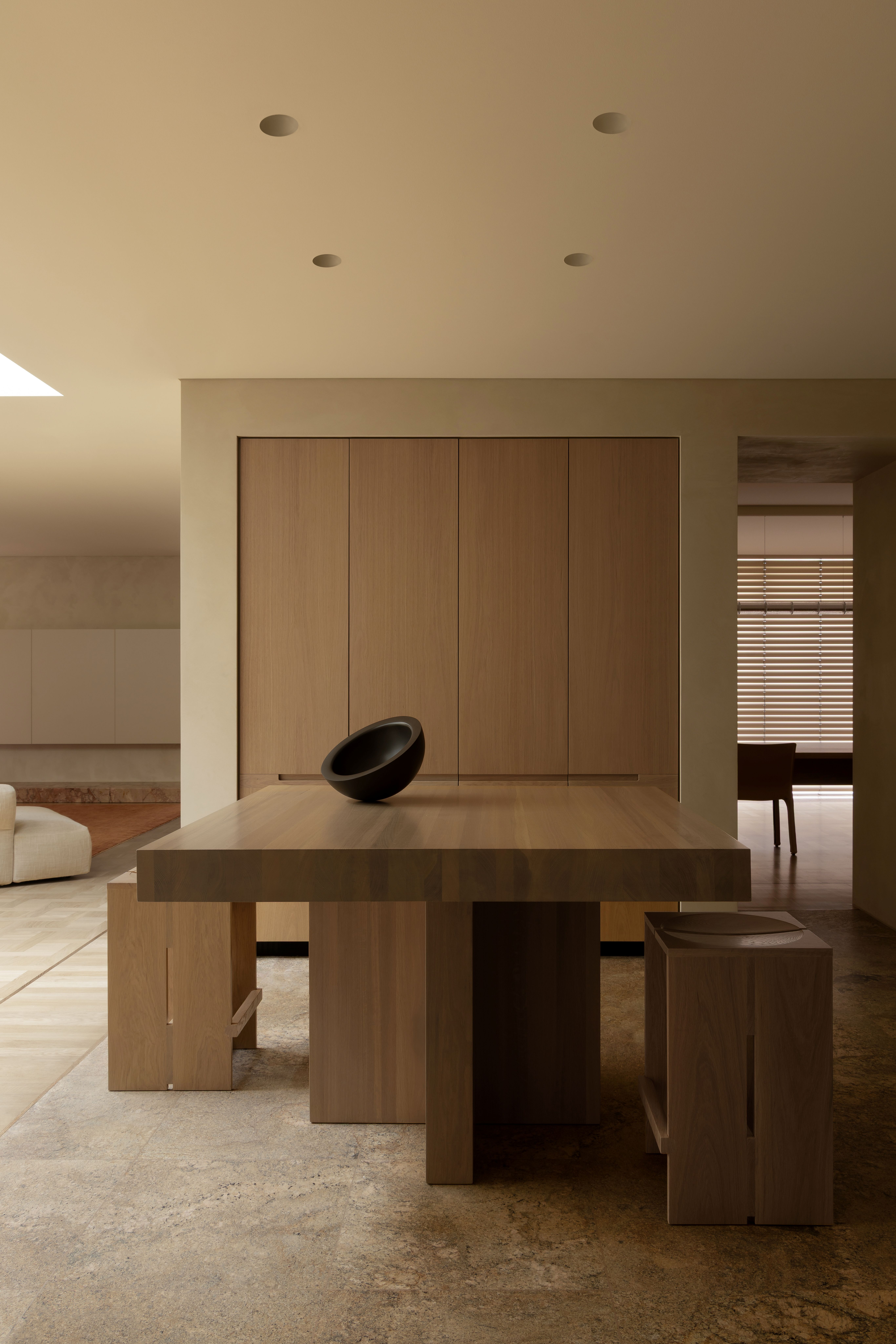 Dining space with large, geometric wood table