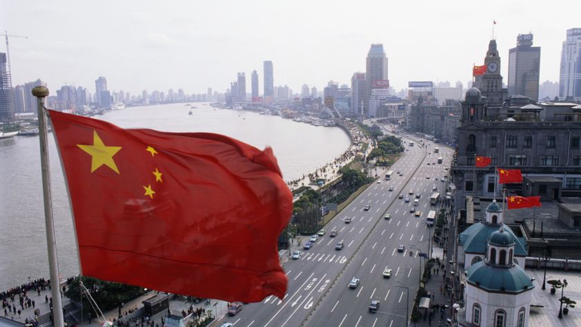 A Chinese flag flies high over The Bund.