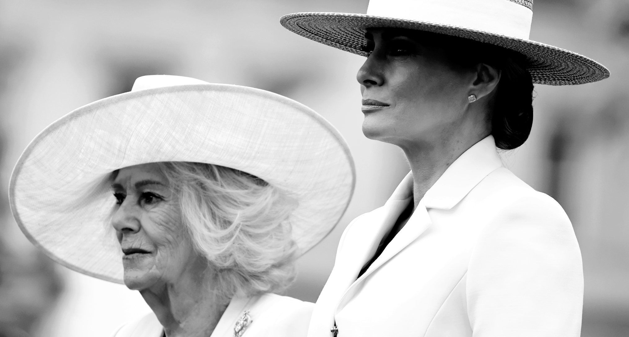 Queen Camilla and Melania Trump wearing hats and white coats