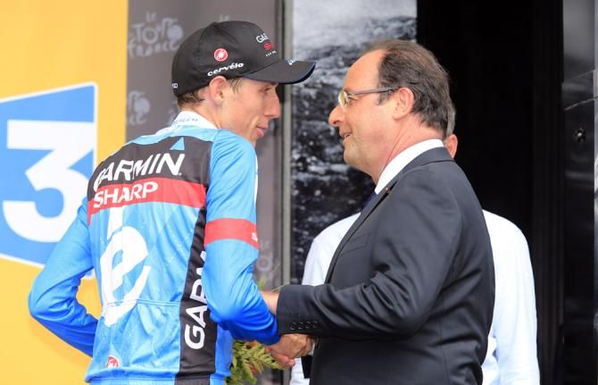 Stage 9 winner Daniel Martin (Garmin-Sharp) has a word with French president Fran&ccedil;ois Hollande on the podium