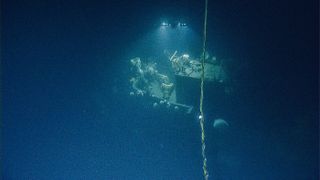 Researchers dive to the wreck of the WW II-era aircraft, the USS Independence.