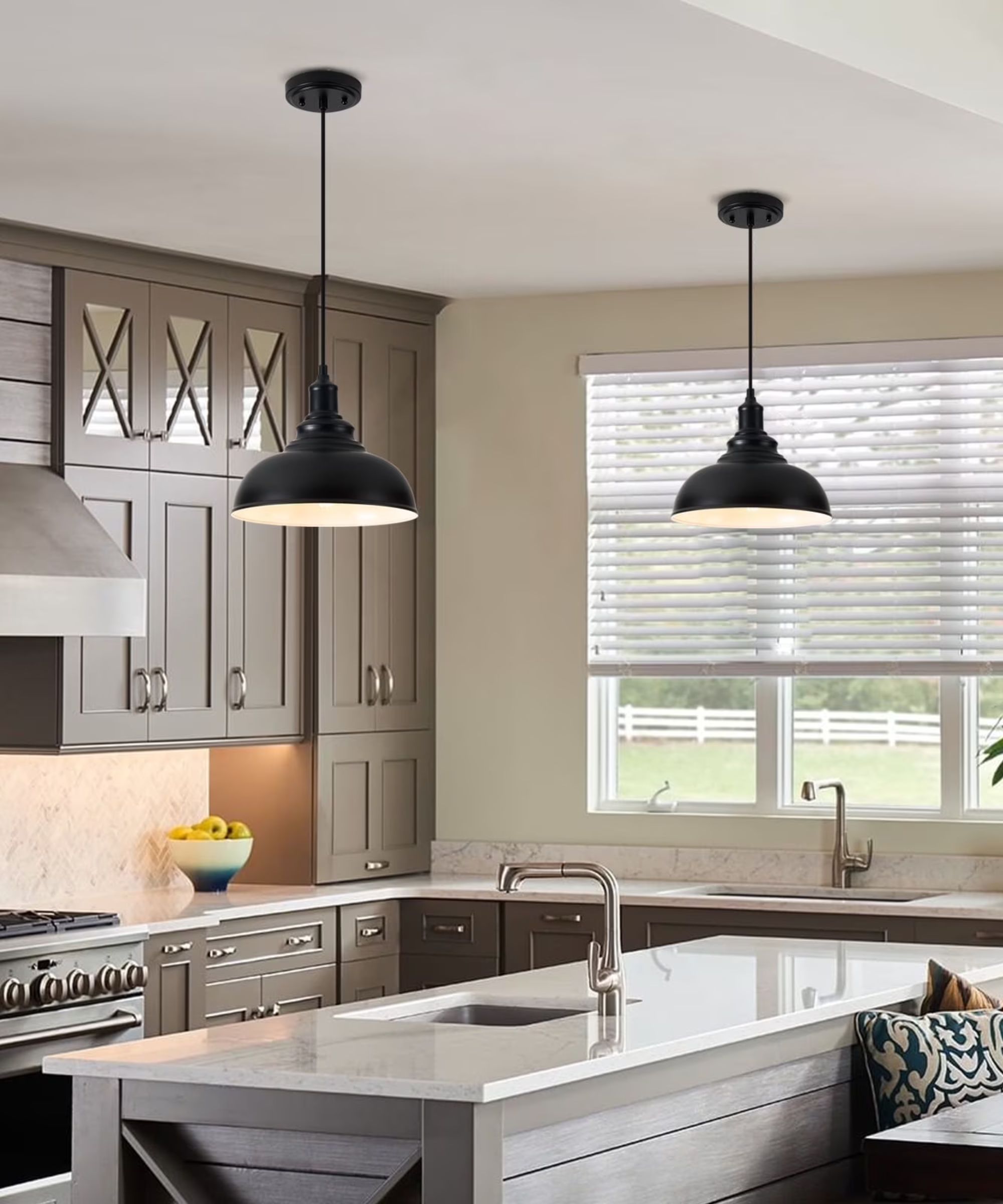 A kitchen with black pendant lights