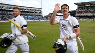 Jamie Smith and Joe Root celebrate after walking off unbeaten in their test victory against India at Headingley, Leeds.
