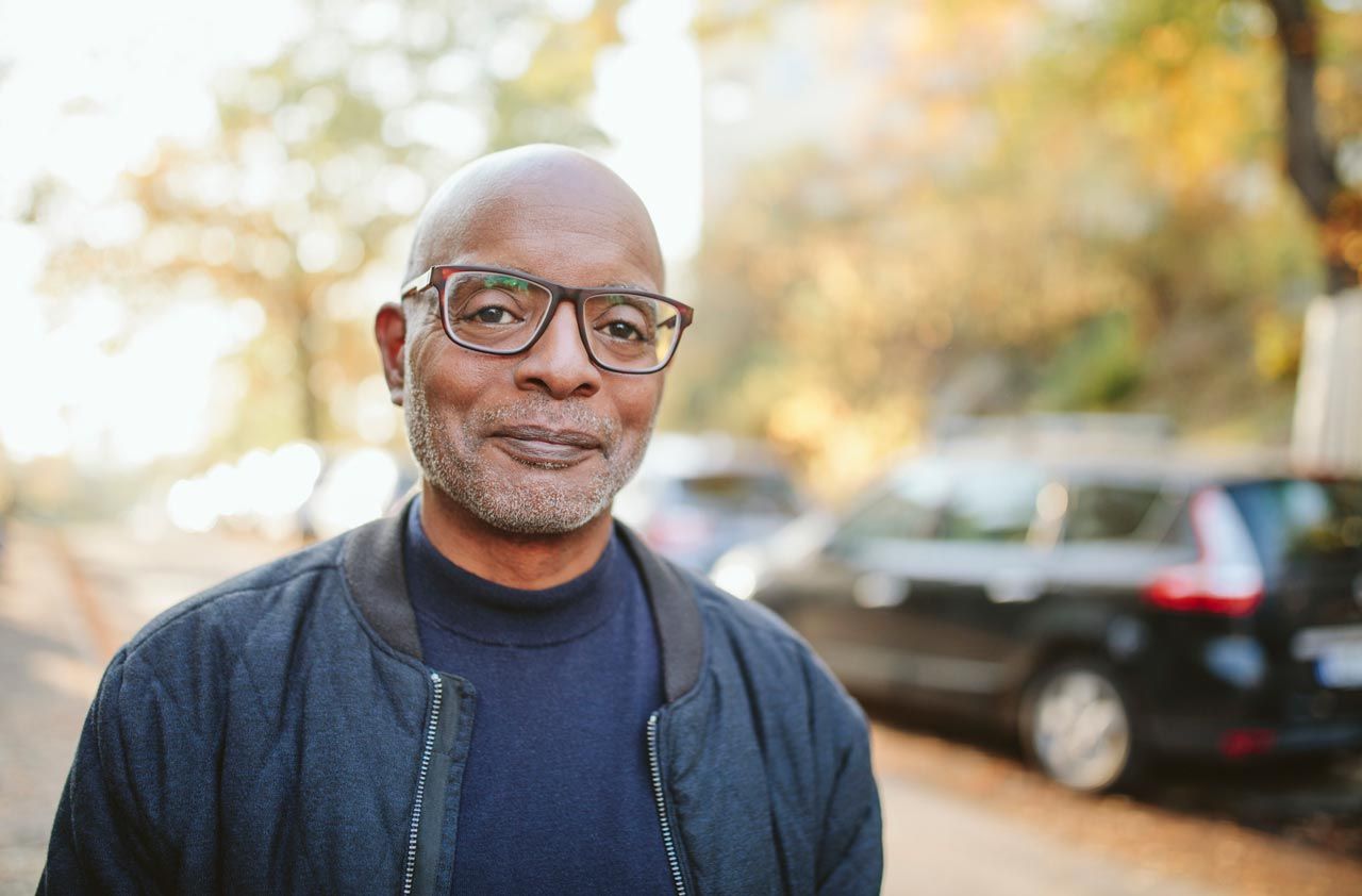 A man has a pensive look on his face.