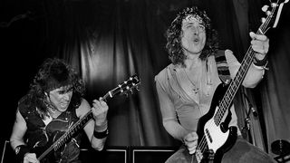 Dave Meniketti (left) and Phil Kennemore perform live onstage in 1983