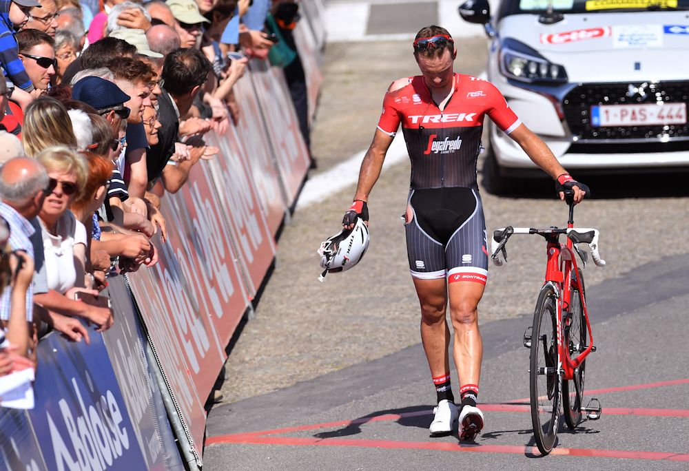 Edward Theuns walks to the finish after crashing in the finish of stage 1 at the Belgium Tour.