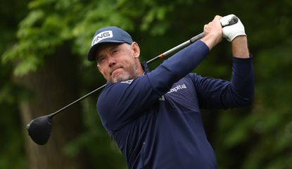 Westwood hits a tee shot with a driver