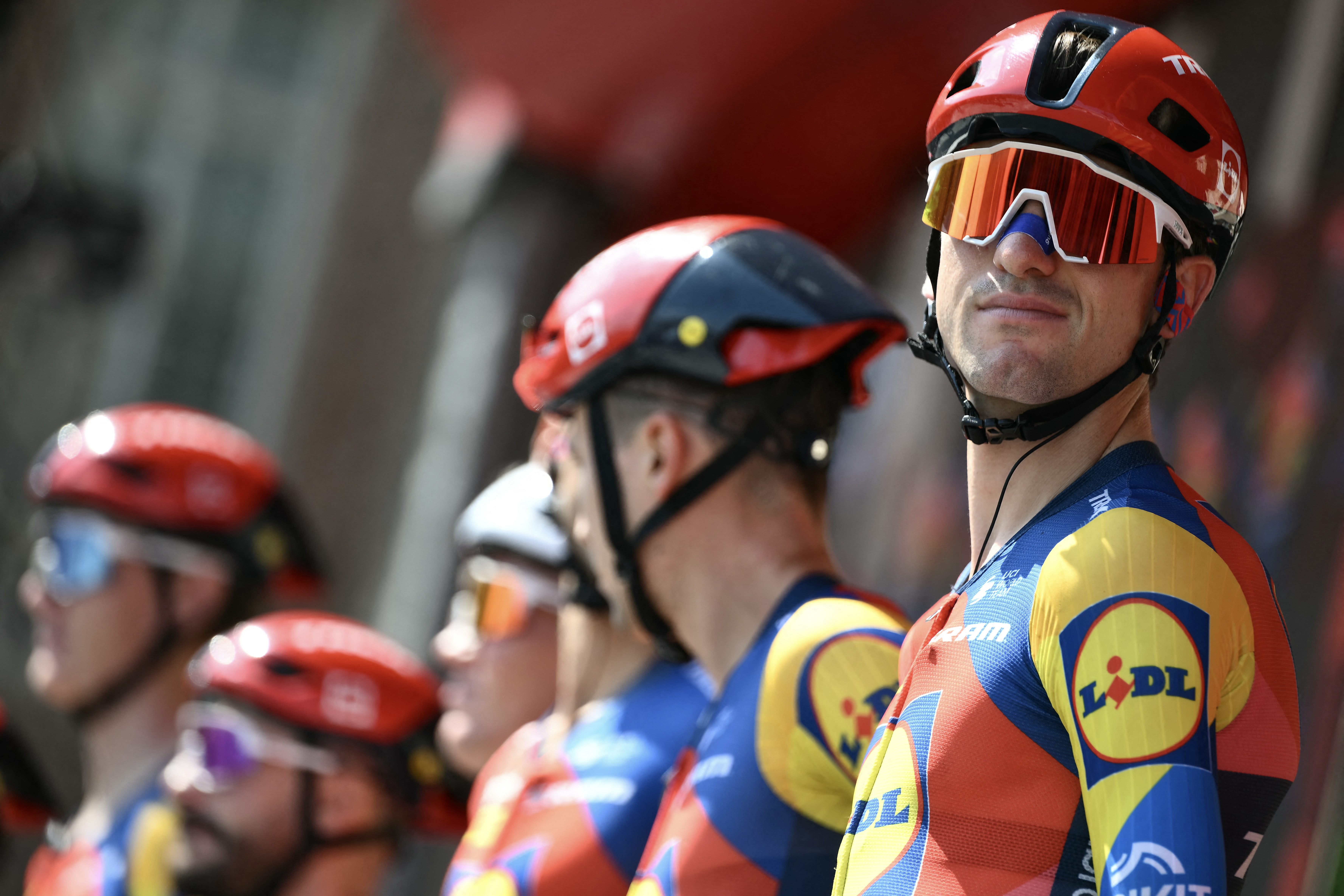 Team Lidl-Trek&#039;s Italian rider Giulio Ciccone is presented on stage with his team before the start of the first stage of the Vuelta a Espana, a 183 km race between Torino - Reggia di Venaria and Novara, in Italy&#039;s Piemonte region, on August 23, 2025. (Photo by Marco BERTORELLO / AFP)