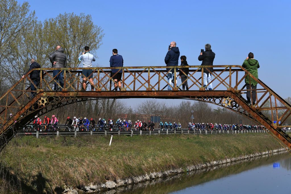 SANREMO ITALY MARCH 20 The Peloton during the 112th MilanoSanremo 2021 a 299km race from Milano to Sanremo Bridge Fans Public Landscape MilanoSanremo La Classicissima UCIWT on March 20 2021 in Sanremo Italy Photo by Tim de WaeleGetty Images