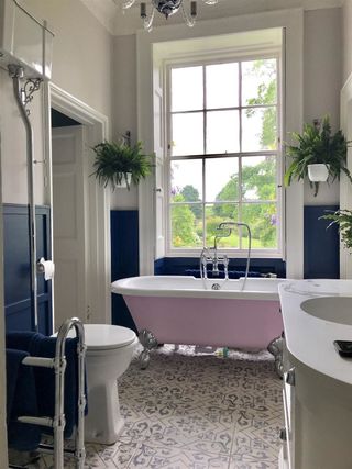 Blue wall paneled bathroom by Farrow and ball