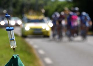 Picture shows a syringe on the side of the road to denounce cycling doping as the pack rides by during the 17th stage of the 94th Tour de France cycling race between Pau and Castelsarrasin 26 July 2007 AFP PHOTO JOEL SAGET Photo credit should read JOEL SAGETAFP via Getty Images