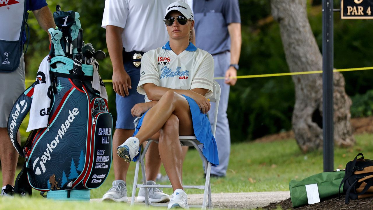 charley hull waiting on a tee box on a golf course