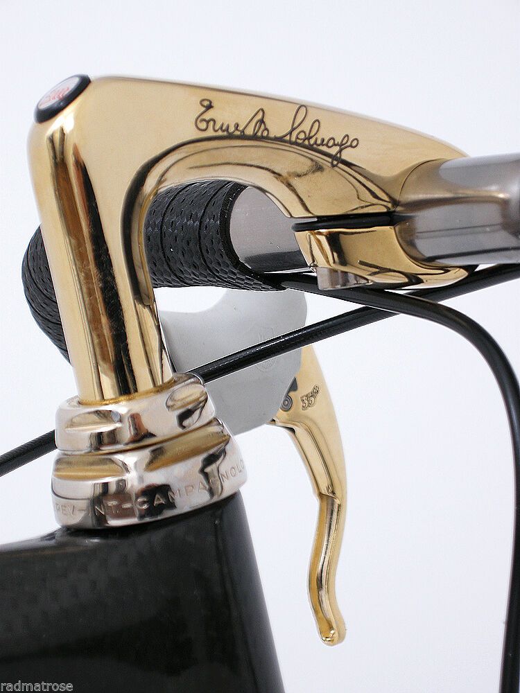 The bike features this custom, gold-plated-Colnago-branded 3TTT stem