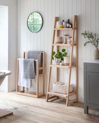 light and fresh bathroom scheme with wooden ladder shelf and towel rail