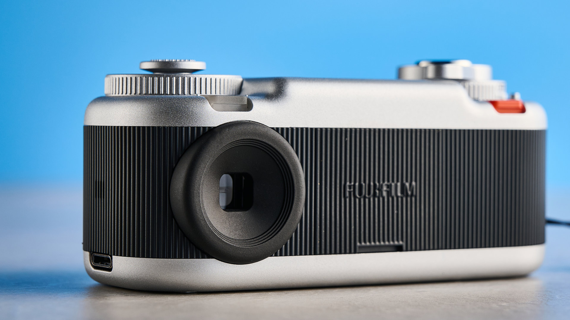 A black and silver Fujifilm Instax Pal 2 digital camera