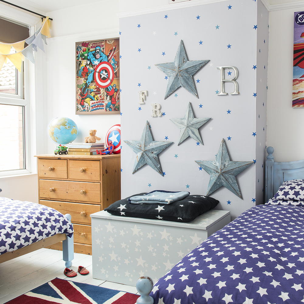 kids room with feature wall and twin wooden beds
