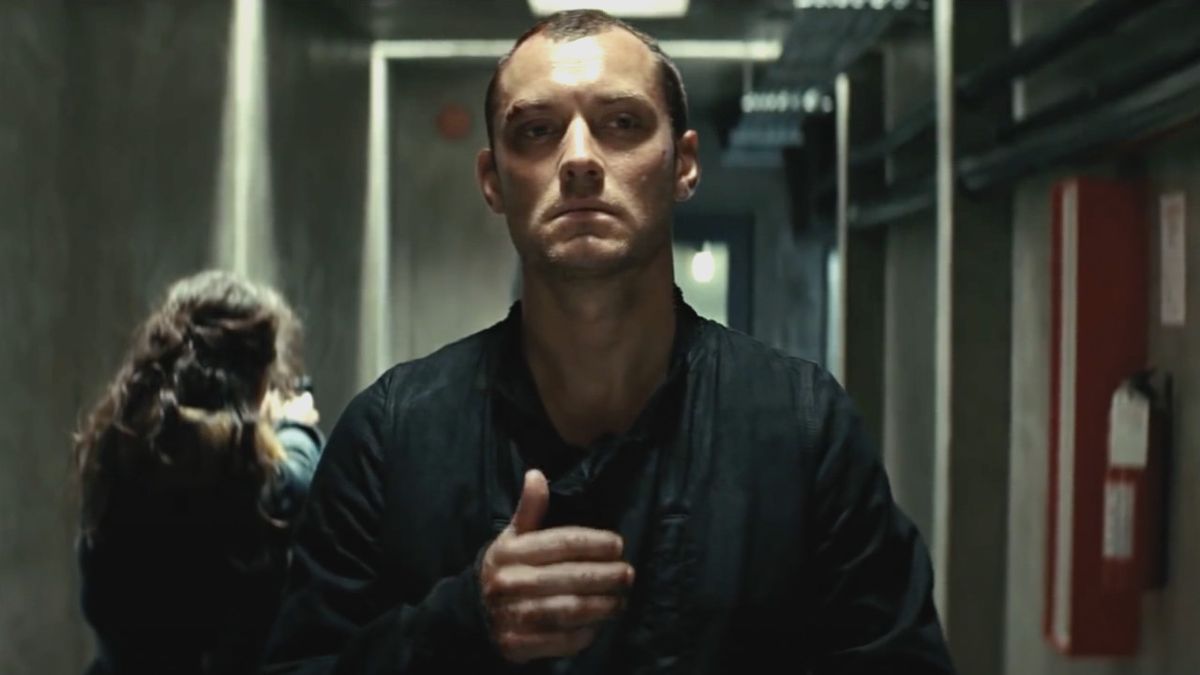 Remy (Jude Law) walks down a corridor in Repo Men