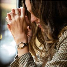 A model wearing a Bulova watch on her wrist.