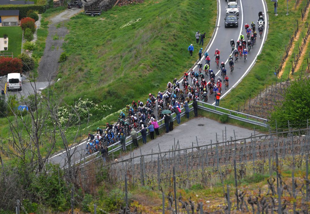 THYON 2000 LES COLLONS SWITZERLAND MAY 01 The Peloton passing through Bramois Village beginning climb of Suen 1430m during the 74th Tour De Romandie 2021 Stage 4 a 1613km stage from Sion to Thyon 2000 Les Collons 2076m Fans Public Landscape Vineyards TDR2021 TDRnonstop UCIworldtour on May 01 2021 in Thyon 2000 Les Collons Switzerland Photo by Luc ClaessenGetty Images
