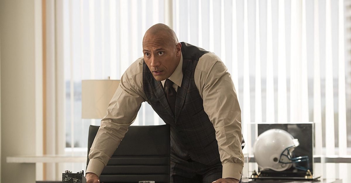 Spencer Strassmore leans on his desk in a scene from &#039;Ballers&#039;