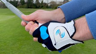 Man gripping a golf club whilst wearing the Me And My Golf True Grip Glove