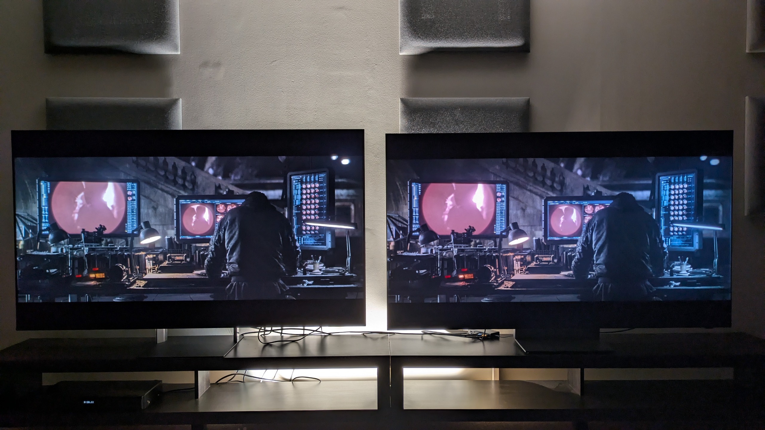 Sony Bravia 9 II vs Samsung R95H showing Bruce in the batcave from The Batman in a dark room. Both TVs show great contrast