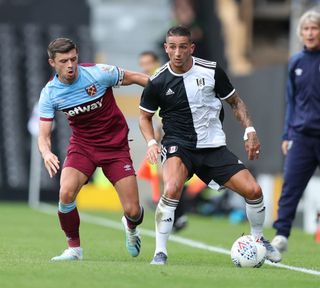 Aaron Cresswell of West Ham and Anthony Knockaert of Fulham during the Pre-Season Friendly match between Fulham FC and West Ham United at Craven Cottage on July 27, 2019 in London, England.