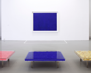 Blue Table IKB® by Yves Klein with gold leaf and pink table in view