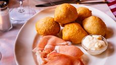Signature dough ball ‘cuddles’ with prosciutto and creamy stracchino cheese 