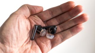 Anker Soundcore Liberty 4 earbuds in hand.