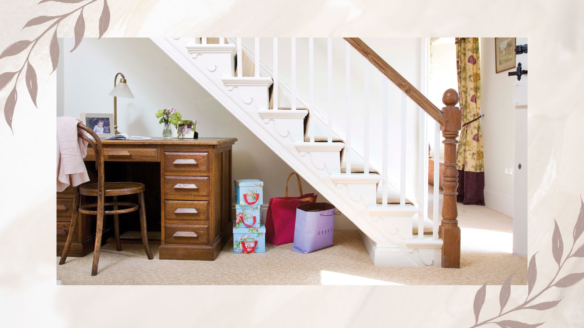 picture of hallway and staircase with bags stored beneath it 