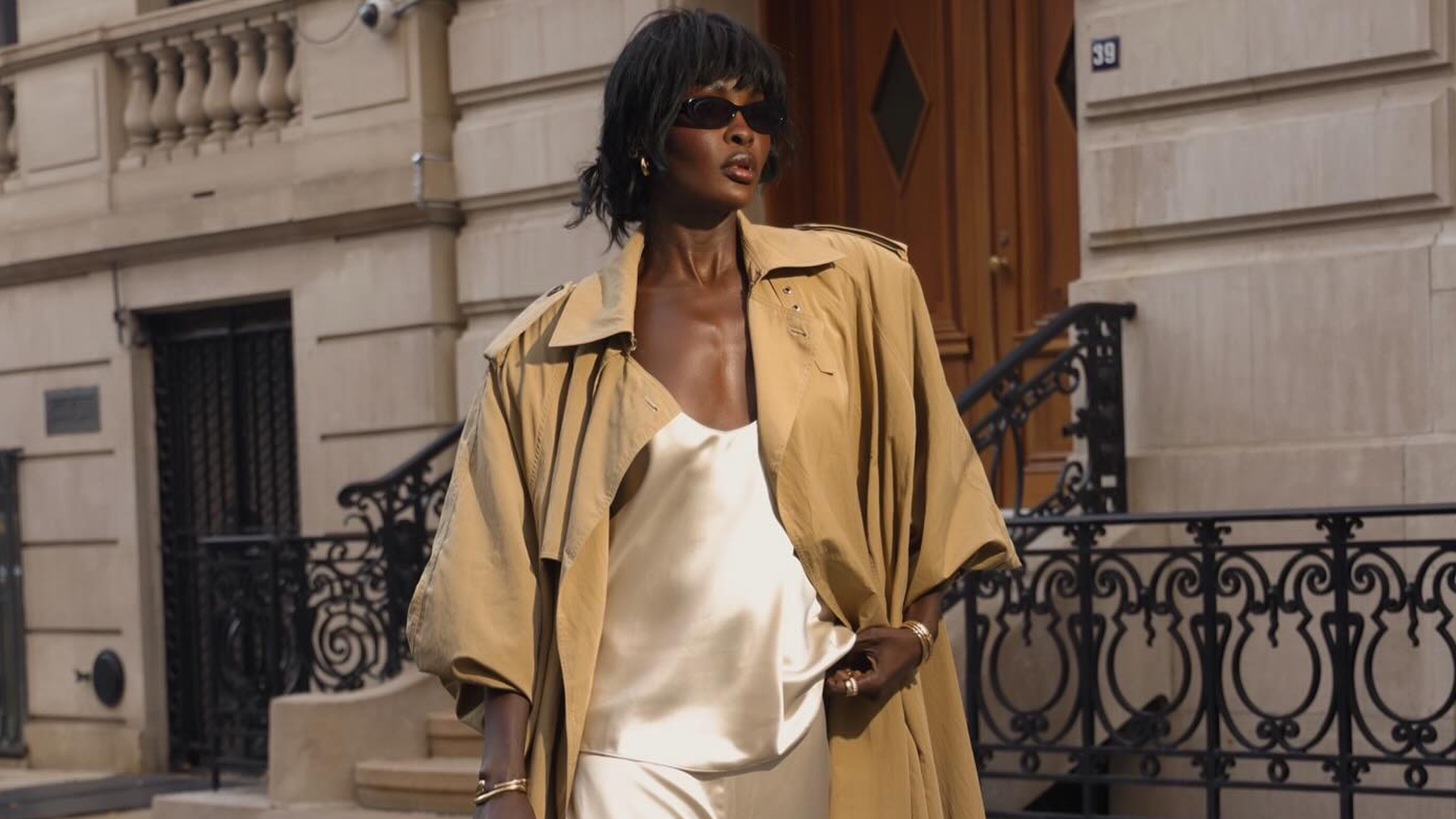 amy lefevre wearing a matching set and trench coat